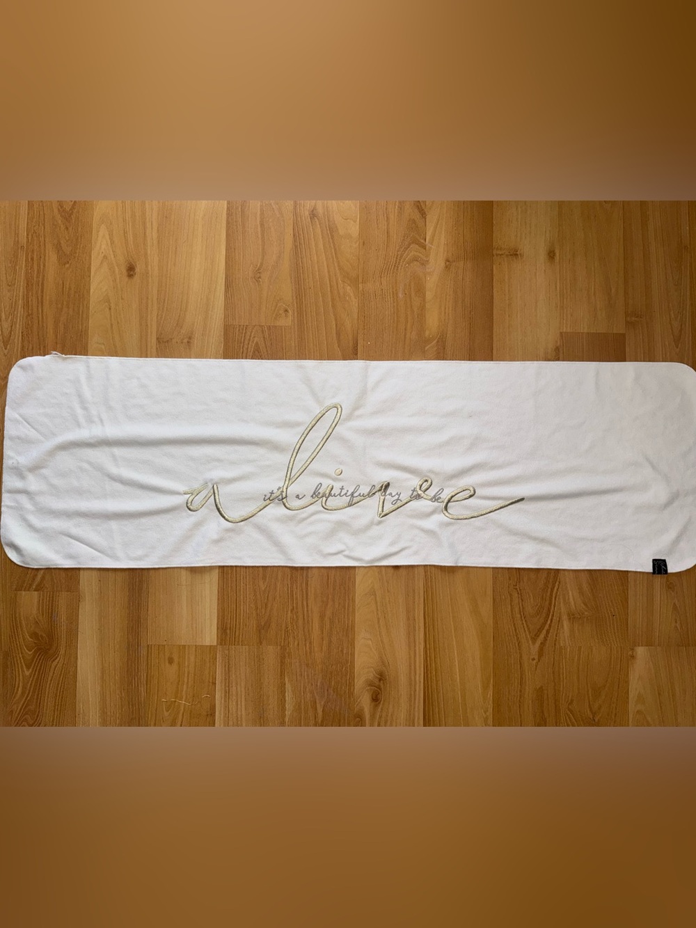 Gymshark Embroidered Sweat Towel with Gold Script Writing